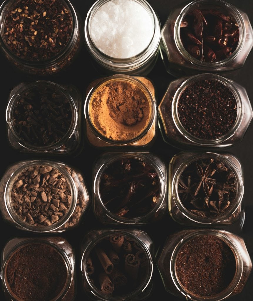 Spice Jars Collection Assorted spices in glass jars for cooking and seasoning.